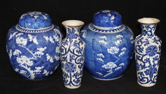 A pair of Chinese blue and white ginger jars and covers and a pair of vases